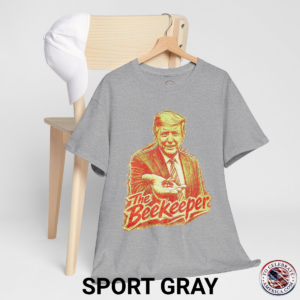 Sport Gray T‑shirt featuring a pencil‑sketch illustration of President Trump holding a small bee in an outstretched hand, with stylized ‘The Beekeeper’ text below.