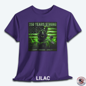 A lilac graphic t-shirt displayed flat, featuring a night-vision green overlay design of a tactical working K9 dog in front of a weathered US flag. The text reads "250 Years Strong" at the top and "HONOR ā
COURAGE ā
LOYALTY" at the bottom.