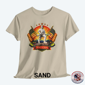Sand Colored Tee featuring Luminescent Minuteman 250th Anniversary design with American flags, stars, and 1776‑2026 banner on patriotic T‑shirt