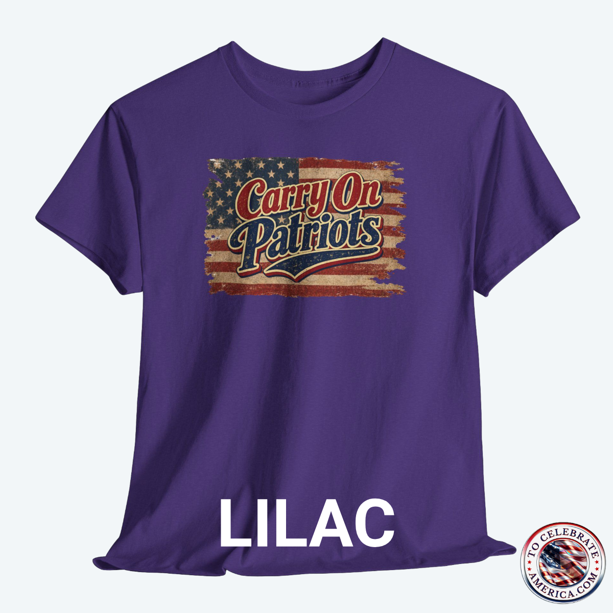 Lilac T‑shirt featuring distressed American flag background with bold ‘Carry On Patriots’ vintage lettering.”
